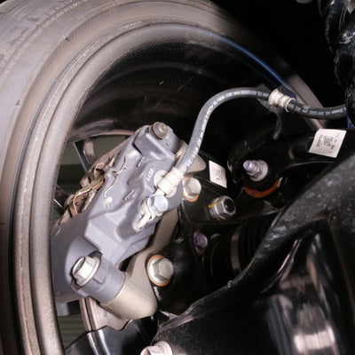 Cusco 23-25 Toyota GR Corolla Light Weight Rear Brake Caliper Bracket - Billet Aluminum